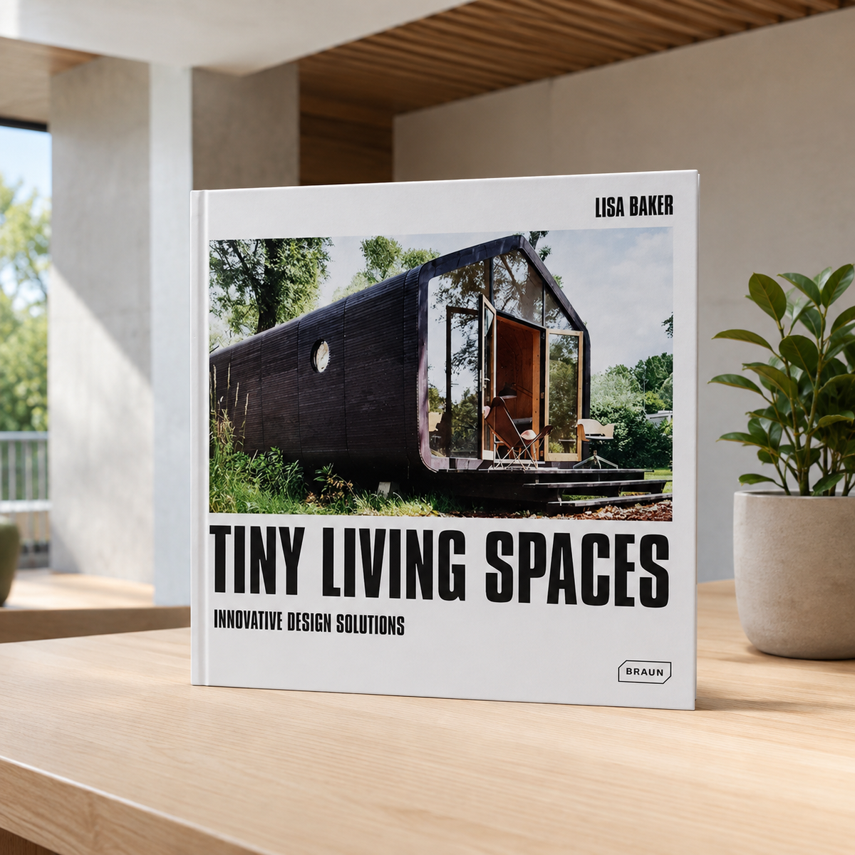 Livro Tiny Living Spaces de Lisa Baker em ambiente contemporâneo